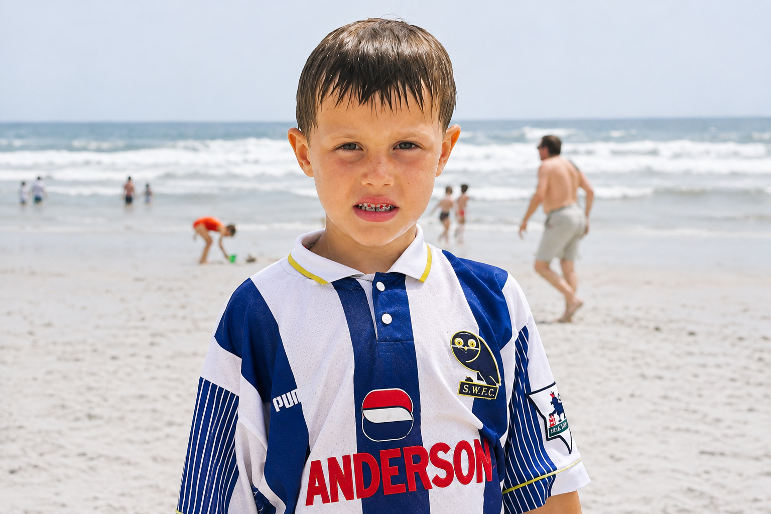 Oly Newton as a young boy on the beach in a Sheffield Wednesday football shirt