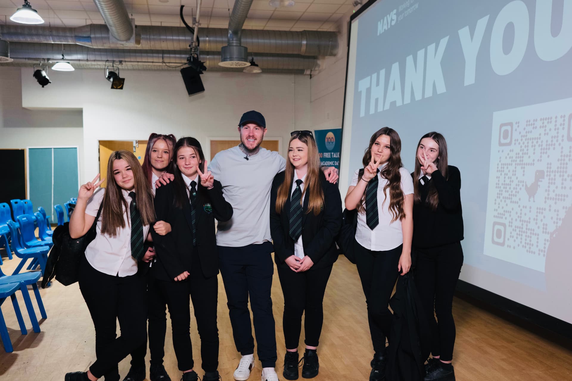 Oly with students after a school assembly